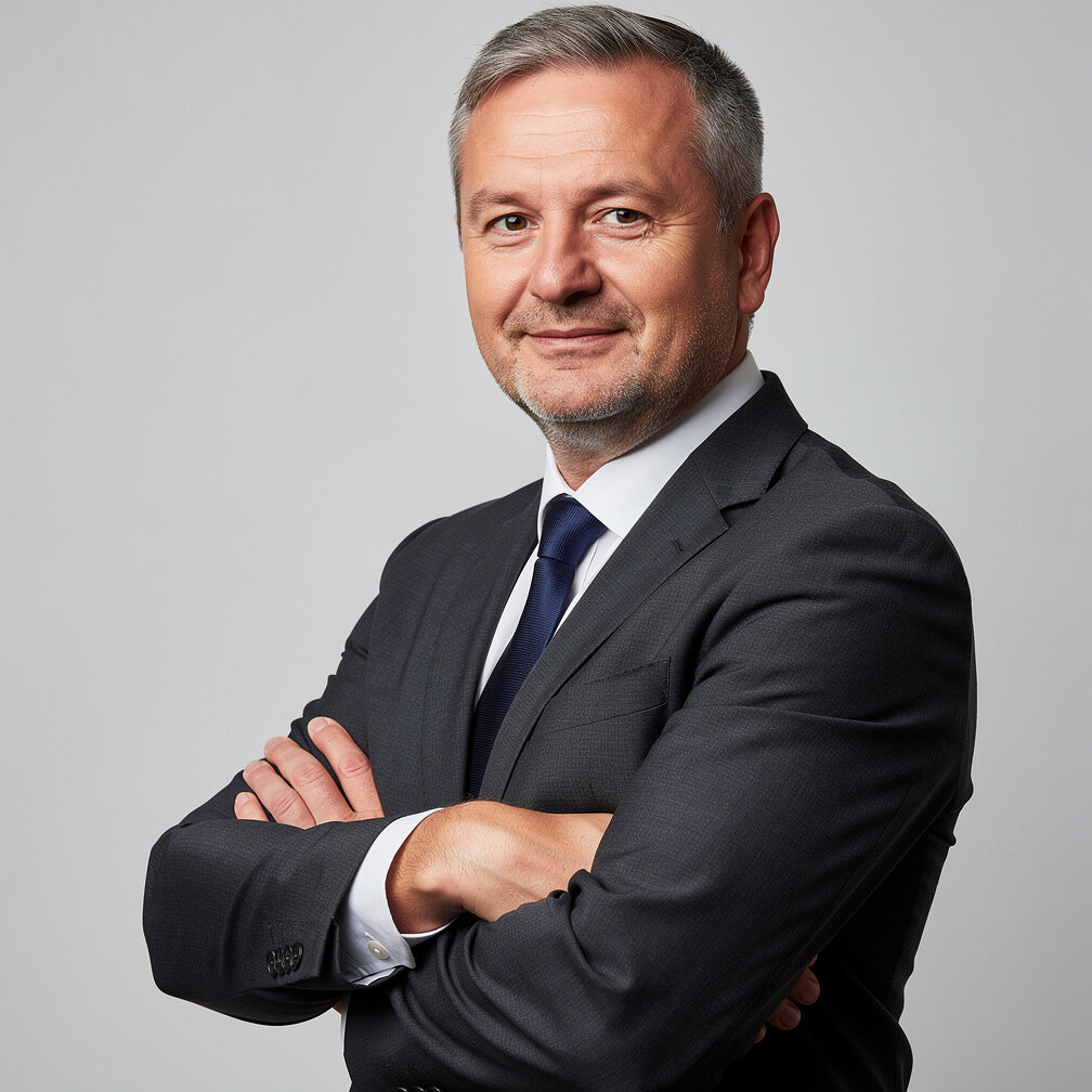 Studio portrait of a middle aged man in a business suit